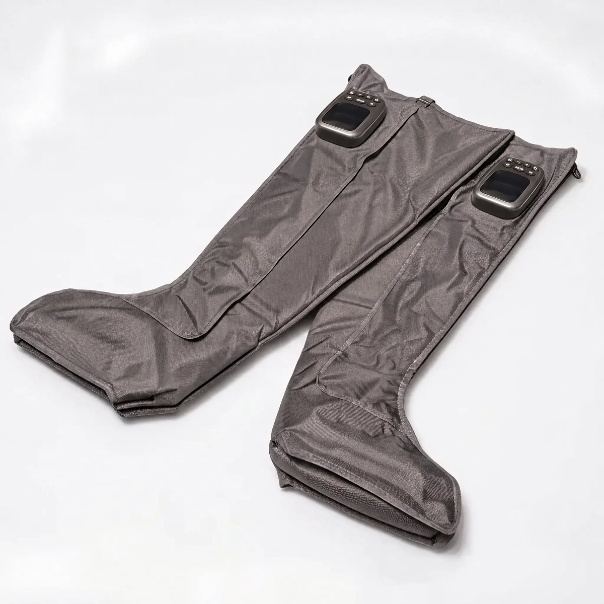 PRFRM 1 FLOW wireless full-leg compression recovery boots laid flat with integrated control units